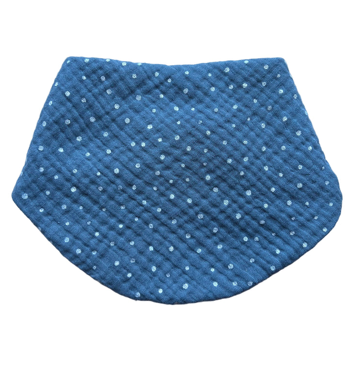 Blue textured pouch with white polka dots on a light gray background