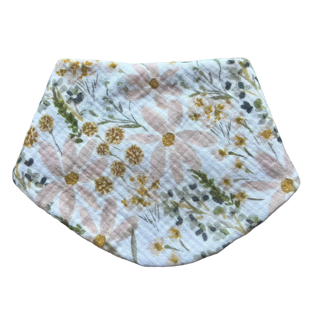 Floral-patterned baby bib on a plain background